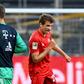 Bayern Munich's Thomas Mueller elbow bumps substitute goalkeeper Sven Ulreich after the Borussia Dortmund win