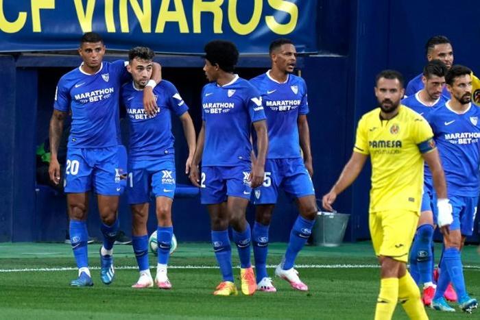 Sevilla forward Munir El Haddadi (2L) ensured the visitors came away with a point at Villarreal