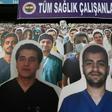 Faces in the crowd: Cardboard cut outs with one picture of Mustafa Kemal Ataturk (back-C), founder of modern Turkey, and photographs of medical staff in front of a banner reading on 'To all our medical staff with respect and gratitude' during the match...