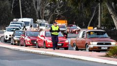 Long queues of cars were backed up at Victoria's border Wednesday after neighbouring state New South Wales closed the boundary