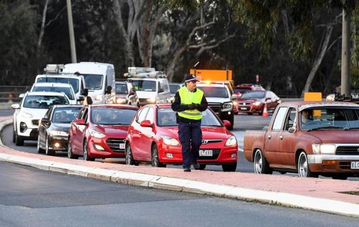 Long queues of cars were backed up at Victoria's border Wednesday after neighbouring state New South Wales closed the boundary