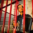 Kacey Wong's performance art involved playing China's national anthem as he sat in a cage