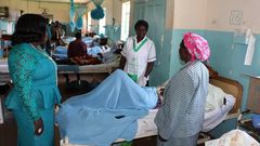 Some Health officials at the Kakamega County Referral Hospital checking on a patient at one of the hospital wards. (Facebook)
