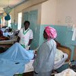 Some Health officials at the Kakamega County Referral Hospital checking on a patient at one of the hospital wards. (Facebook)