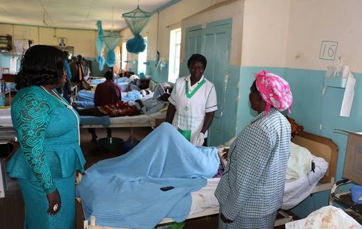 Some Health officials at the Kakamega County Referral Hospital checking on a patient at one of the hospital wards. (Facebook)