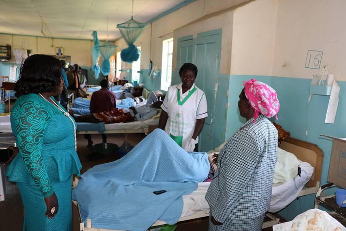 Some Health officials at the Kakamega County Referral Hospital checking on a patient at one of the hospital wards. (Facebook)