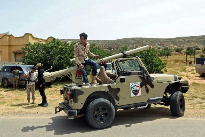 Fighters for Libya's UN-recognised Government of National Accord (GNA) gather at a position near the town of Garabulli, some 70km east of the capital Tripoli, amid battles with forces loyal to the Libyan strongman Khalifa Haftar earlier this month