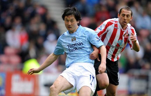 Sun Jihai (left) playing for Manchester City in 2008