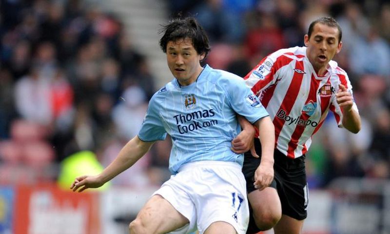 Sun Jihai (left) playing for Manchester City in 2008