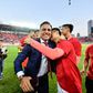 Guangzhou Evergrande's head coach Fabio Cannavaro celebrates with his players and after winning the Chinese Super League last season. They will now be able to begin their delayed title defence from July 25