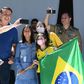 Brazilian President Jair Bolsonaro and his daughter Laura (C) pose for a selfie with supporters outside his residence in Brasilia on Sunday
