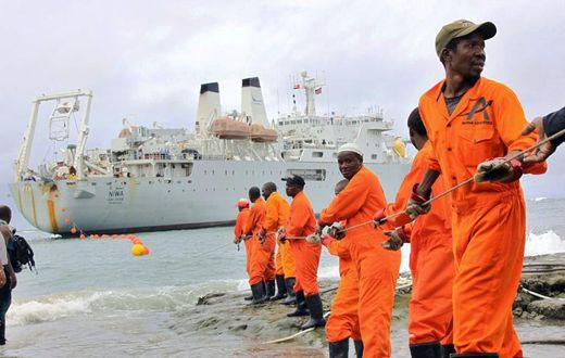 Workers at the Kenyan port of Mombasa haul ashore a fibre optic cable in June 2009 as part of a scheme to boost internet connectivity in East Africa