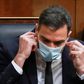 Spanish Prime Minister Pedro Sanchez wears a mask -- his government says it will keep the measure in place until a coronavirus vaccine is found