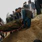 Mourners burying a victim of the militant attack on a Kabul hospital