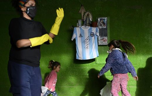 Diego Maradona's autographed shirt is displayed at a community eatery in Buenos Aires