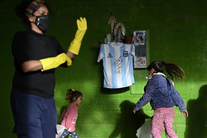 Diego Maradona's autographed shirt is displayed at a community eatery in Buenos Aires