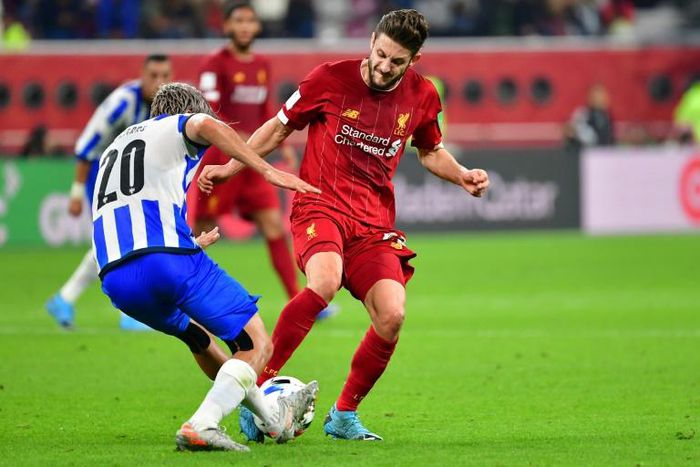 Liverpool midfielder Adam Lallana (R) has agreed a new short-term contract for the rest of this season