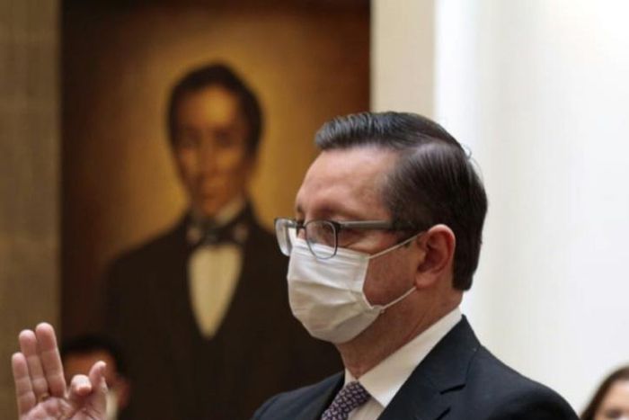 Oscar Ortiz is sworn in as the new economy minister at the presidential palace in La Paz on July 7, 2020