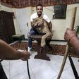 Egyptian lion tamer Ahsraf el-Helw poses with his lioness Joumana at his home in Cairo