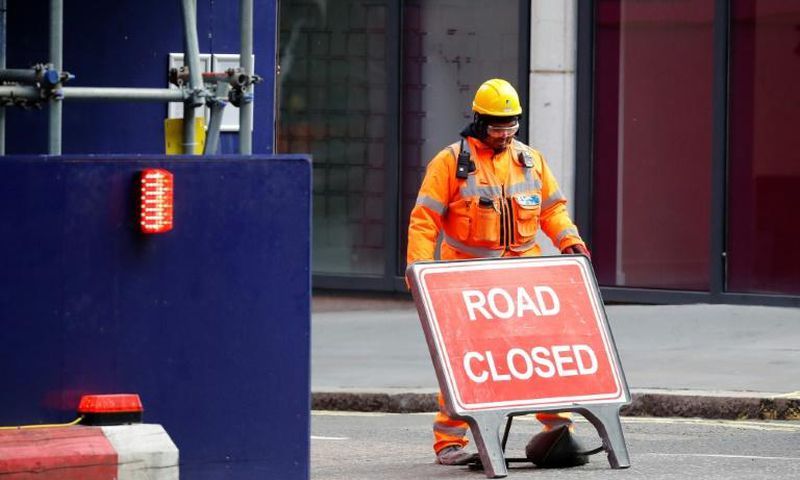 Britain's economy shrank two percent in the first three months of the year, rocked by the fallout from the coronavirus pandemic, official data shows