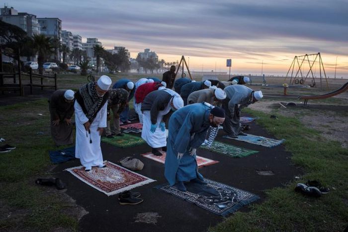 Muslims pray in Cape Town before looking for the crescent moon that signals the start of Ramadan