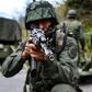 The Venezuelan military is undertaking a massive air, sea and land search for remnants of attackers the government described as "mercenaries"