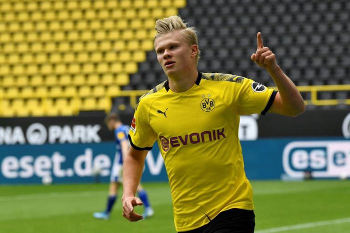 Erling Braut Haaland celebrates after scoring the opening goal for Borussia Dortmund against Schalke