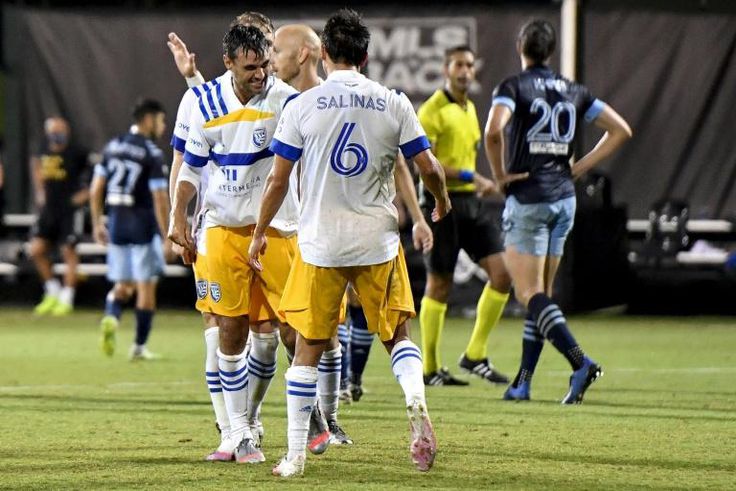 Chris Wondolowski Shea Salinas of the San Jose Earthquakes celebrate after beating the Vancouver Whitecaps 4-3 in Major League Soccer's MLS is Back tournament in Orlando, Florida