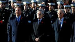 In an exceptional move, ex-Labour party leaders Tony Blair (R, pictured November 2019 at a Remembrance Sunday ceremony) and Gordon Brown (C) joined Prime Minister Boris Johnson's Conservative predecessor David Cameron (L) in criticising the plan