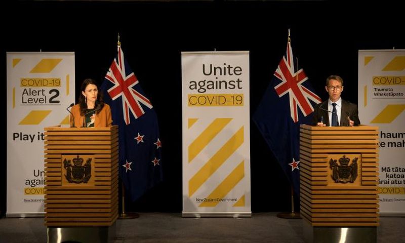Prime Minister Jacinda Ardern (L) said the minister's presence had become a distraction. He had also been accused of blaming top health official Ashley Bloomfield (R)