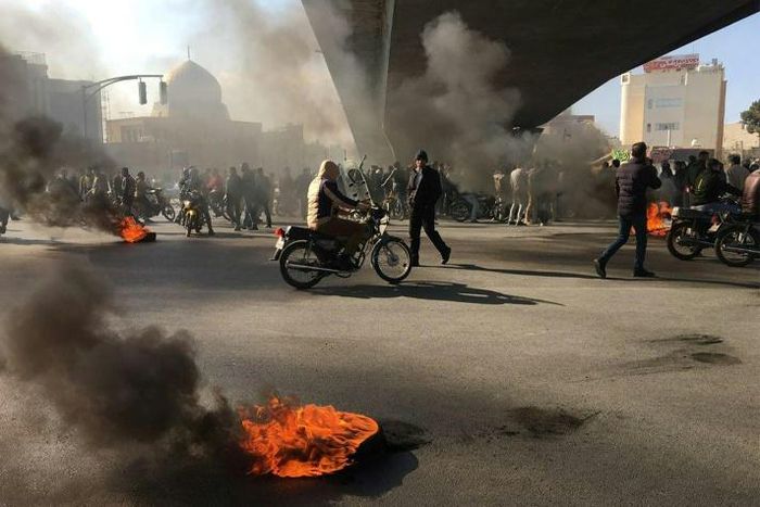 Iranian protesters angered by an increase of up to 200 percent in the price of petrol gather under an overpass in the central city of Isfahan on November 16, 2019