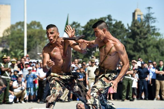 In this 2017 file photo members of the Algerian Special Forces demonstrate their martial arts skills during a parade  marking the 55th anniversary of Algerian independence