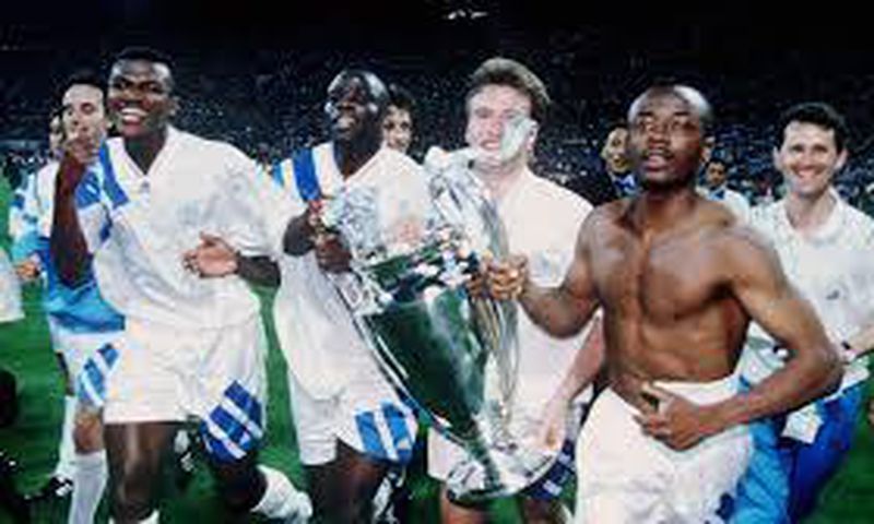 Abedi Pele and his Marseille teammates celebrate after beating AC Milan in the final