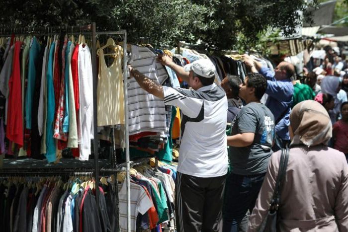 In a large street market in Damascus, customers perused stalls days ahead of the Eid al-Fitr holiday, which marks the end of the Islamic holy month of Ramadan