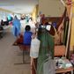 Patients with COVID-19 are treated in the corridor of a hospital in the Amazon city of Iquitos, on May 14, 2020