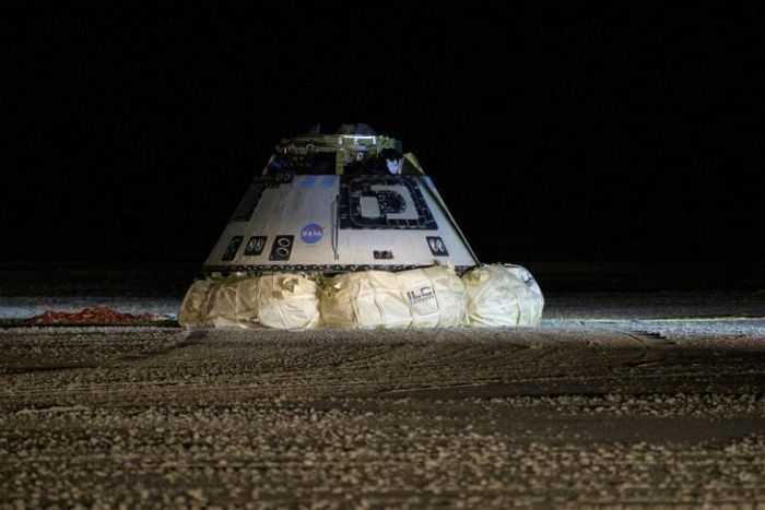 A Boeing Starliner capsule touches down in White Sands, New Mexico in December 2019 after an unsuccessful uncrewed test flight