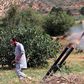 A fighter with Libya's UN-recognised Government of National Accord (GNA) fires rockets towards the city of Tarhuna, southwest of the capital Tripoli, held by the forces of the strongman Khalifa Haftar