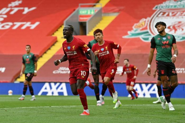 Sadio Mane (centre) celebrates his 20th goal of the season for Liverpool