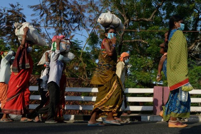 Stranded migrants in Chennai, in southeastern India, prepare to board a special train after the government eased a nationwide coronavirus lockdown