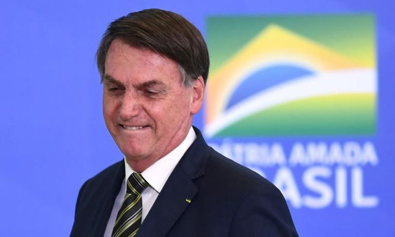 Brazilian President Jair Bolsonaro gestures during the inauguration ceremony of Andre Mendonca as new Justice Minister at Planalto Palace in Brasilia, on April 29, 2020
