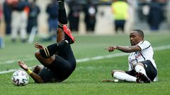 George Maluleka (L) of Kaizer Chiefs tumbles after colliding with Mthokozisi Dube (R) of Orlando Pirates in a match between the biggest South African Premiership crowd-pullers