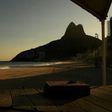 A lifeguard looks out over an empty Ipanema beach as Rio's famous beaches remained closed to all but surfers on April 28, 2020