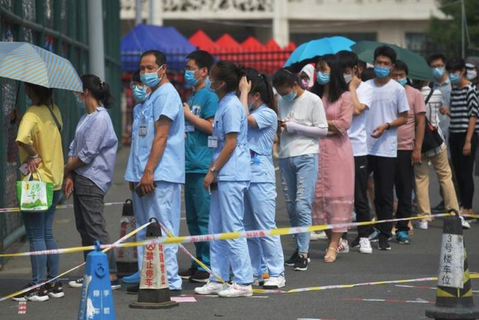 Beijing authorities have said a cluster of coronavirus infections linked to a wholesale food market is 'under control' after mass testing and containment measures