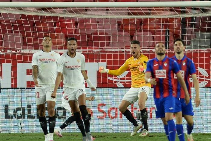 Midfielder Lucas Ocampos celebrates a save after replacing teammate Czech goalkeeper Tomas Vaclik