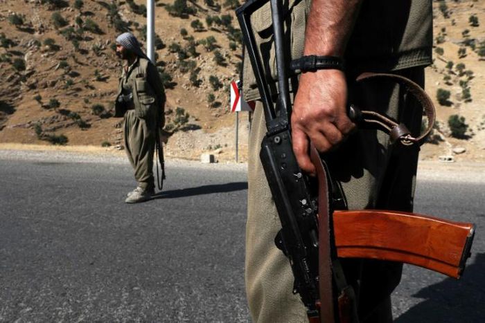 A 2018 file photo shows fighters of the rebel Kurdistan Workers' Party (PKK) manning a roadblock in the Qandil Mountains, the groups's main rear-base in northern Iraq