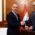 Former Iraqi football star Adnan Dirjal (L) takes the reins as sports minister from his less well-known predecessor Ahmed Ryad