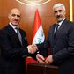 Former Iraqi football star Adnan Dirjal (L) takes the reins as sports minister from his less well-known predecessor Ahmed Ryad