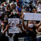 Protestors demand justice for the death of five-year-old Miguel da Silva, who fell from the ninth floor of a building while under the watch of his mother's white employer