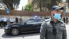 Israeli soldiers stand guard as Prime Minister Benjamin Netanyahu's motorcade arrives at the Jerusalem courthouse for his much-delayed corruption trial