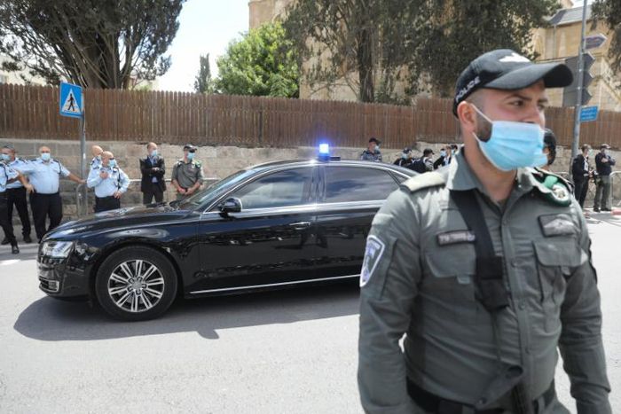 Israeli soldiers stand guard as Prime Minister Benjamin Netanyahu's motorcade arrives at the Jerusalem courthouse for his much-delayed corruption trial